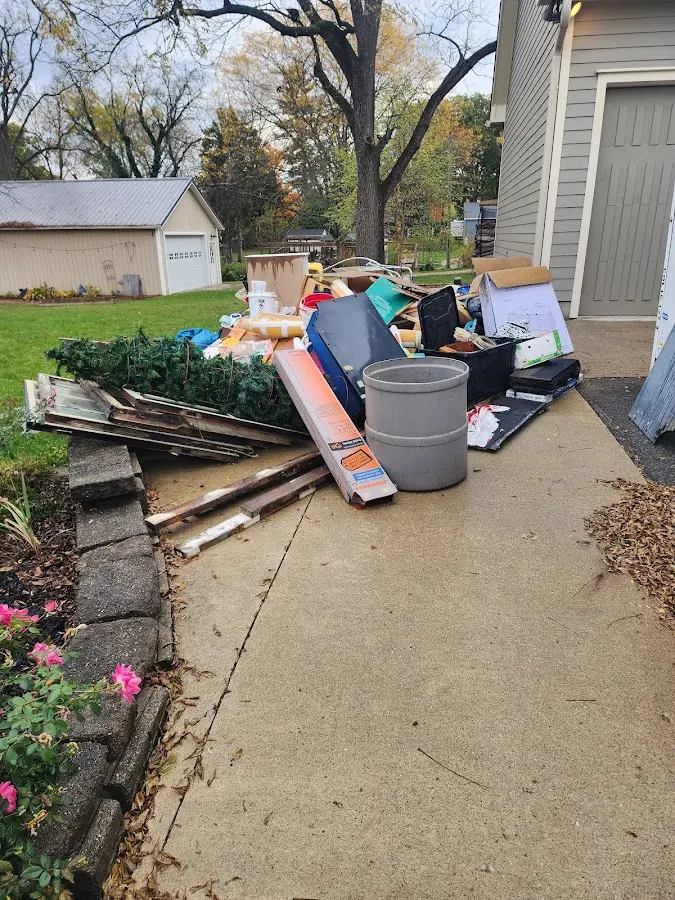 Dumpster being loaded with debris for Demolition Dumpster Rental in Eastover